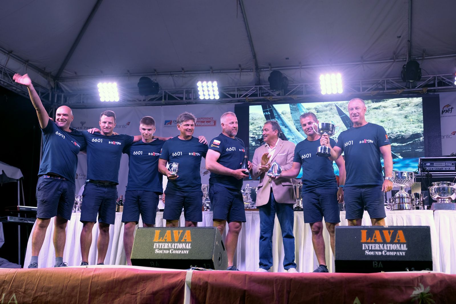 A crew receiving prizes at Antigua Sailing Week