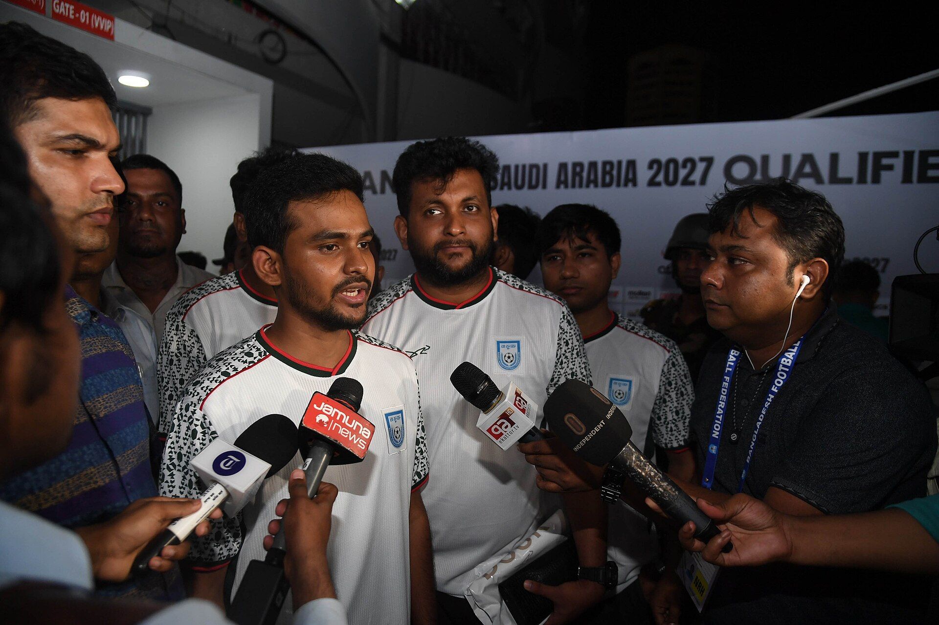 Bangladesh national-team footballers speaking with media after a 2025 match in Dhaka