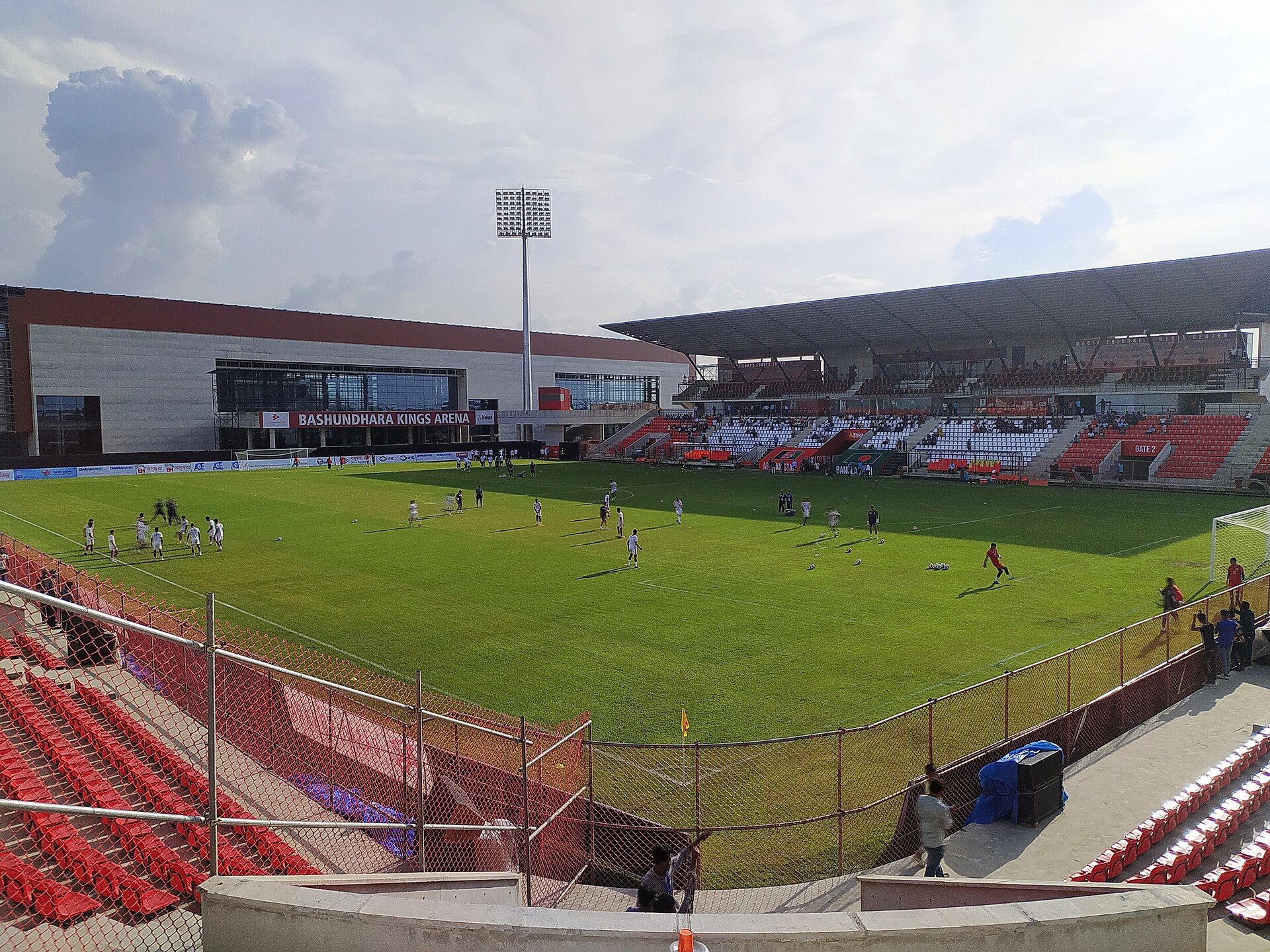 A football match under way at Bashundhara Kings Arena in Dhaka