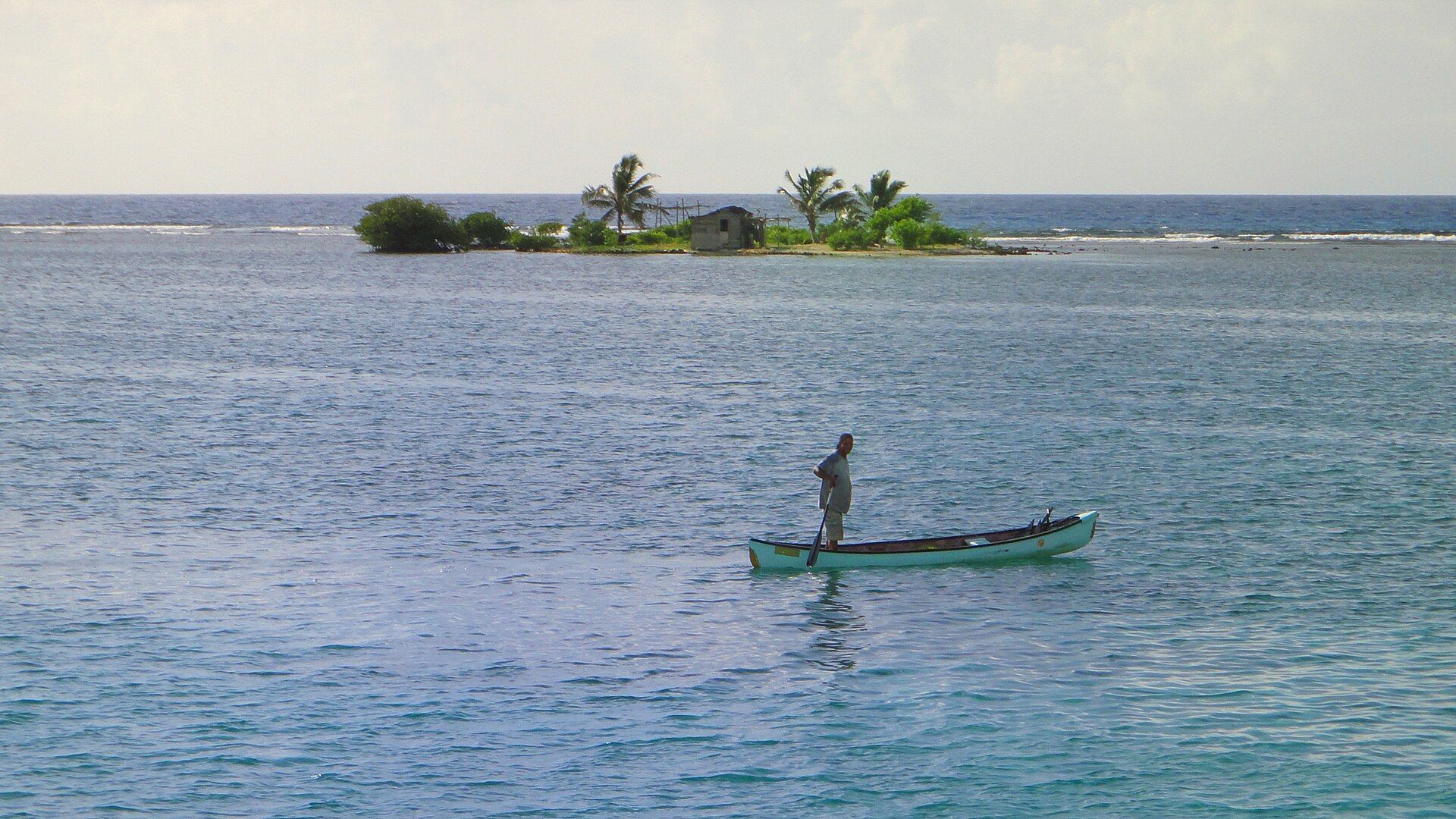Belizean fisherman working from a small boat