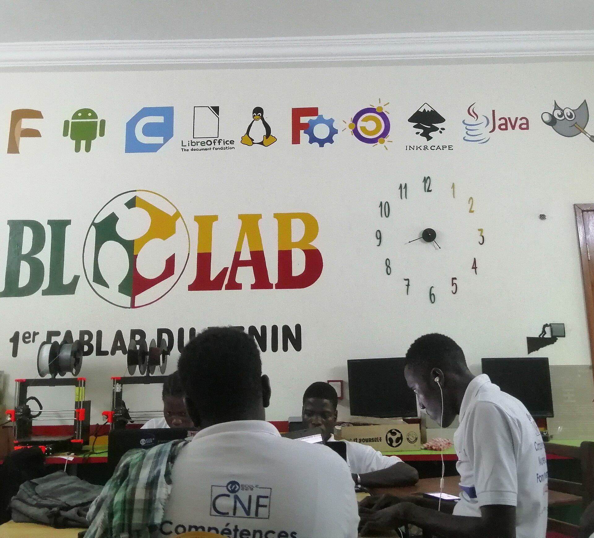 Students collaborating inside the BloLab technology space in Cotonou