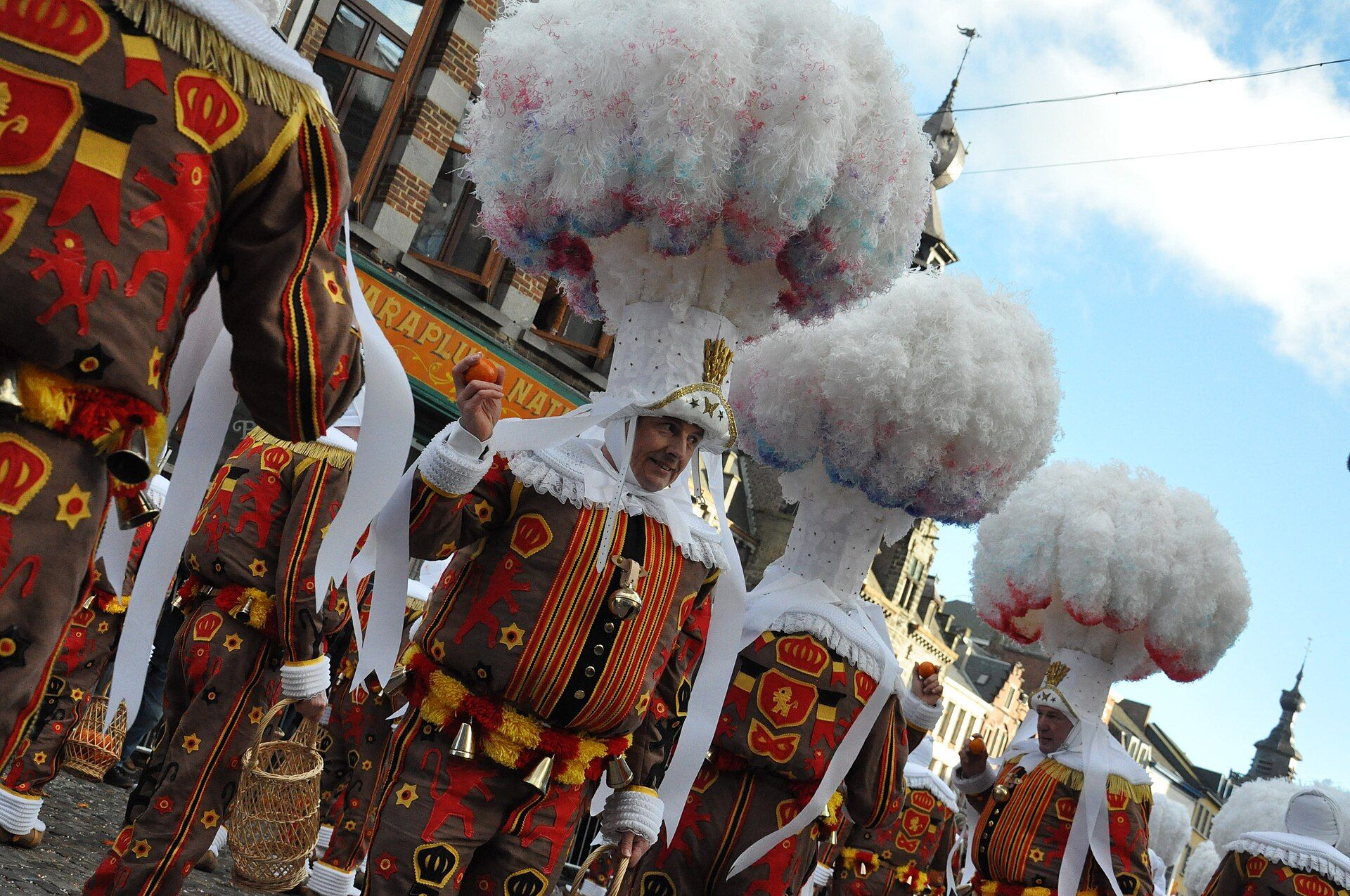 Gille wearing the Carnival of Binche's distinctive wax mask and green glasses