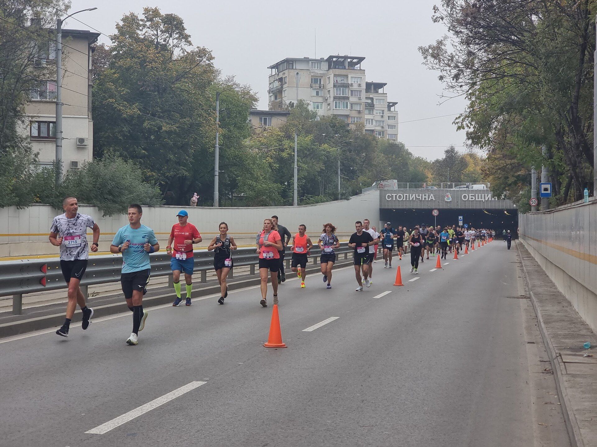 Runners exiting a Sofia road tunnel during the 2024 Sofia Marathon
