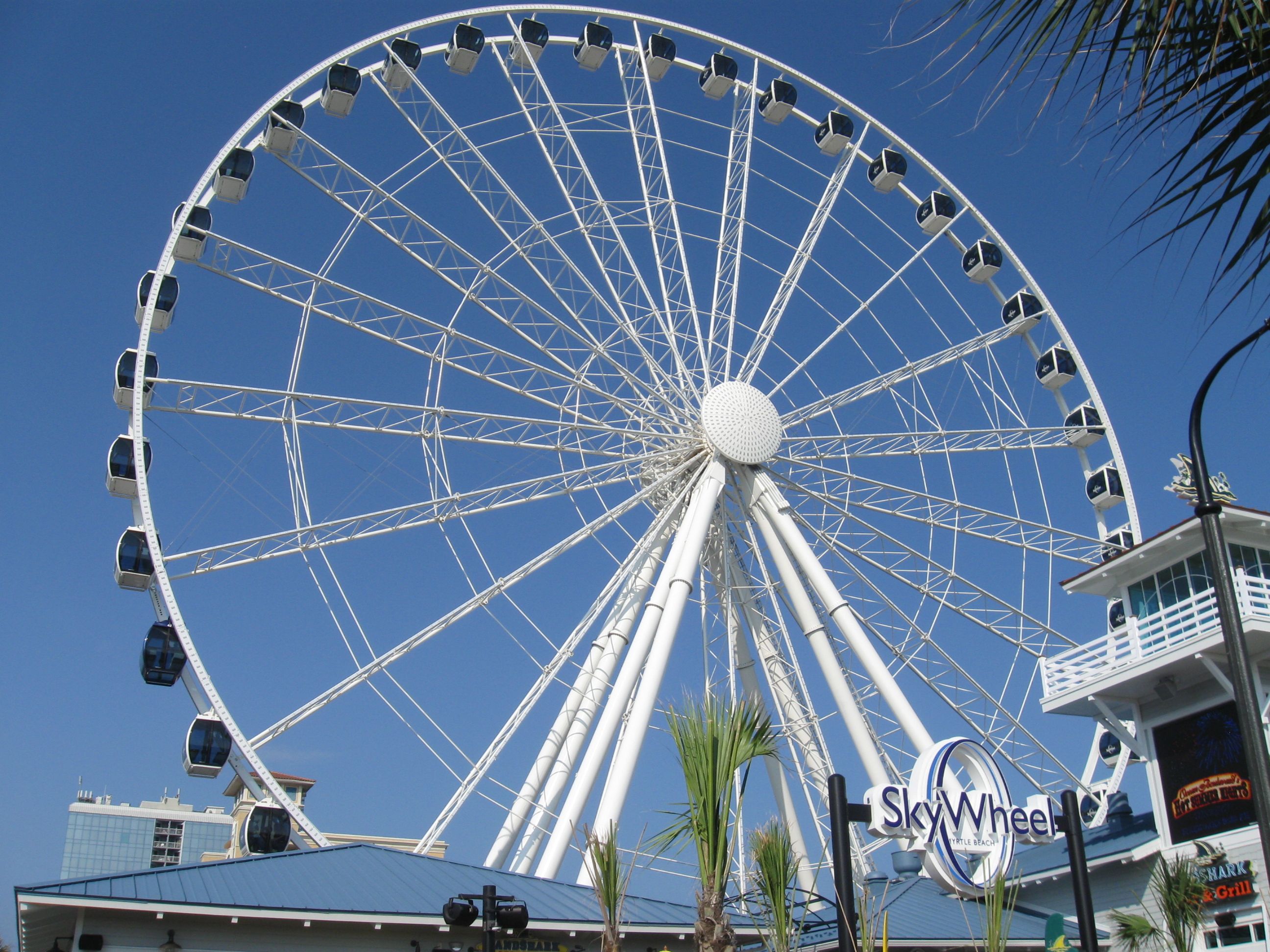 Close-up of the SkyWheel on the Myrtle Beach Boardwalk, the landmark wheel near the festival grounds area; city landmark context, not the event.
