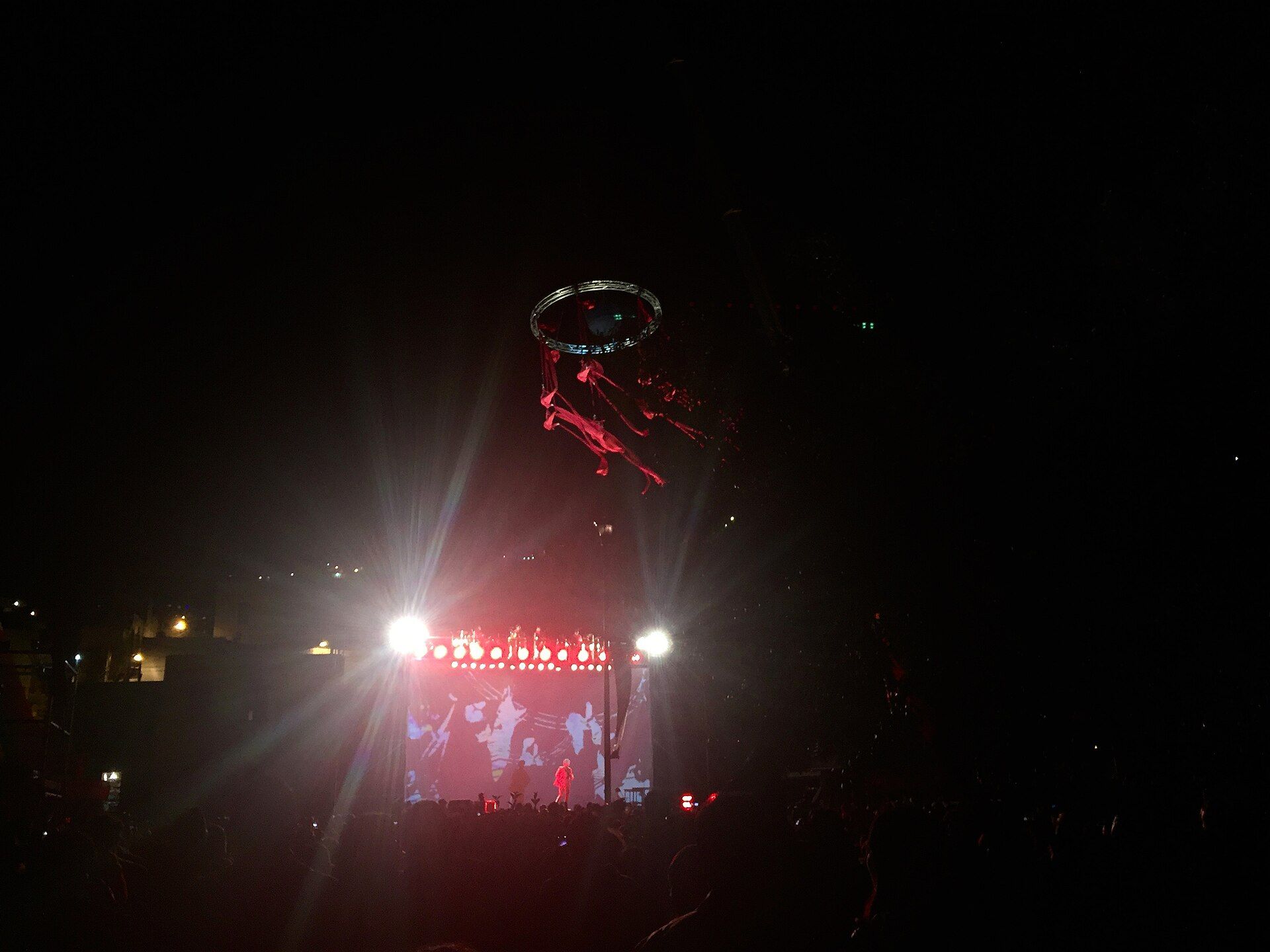 Aerial performers above a nighttime Cervantino audience