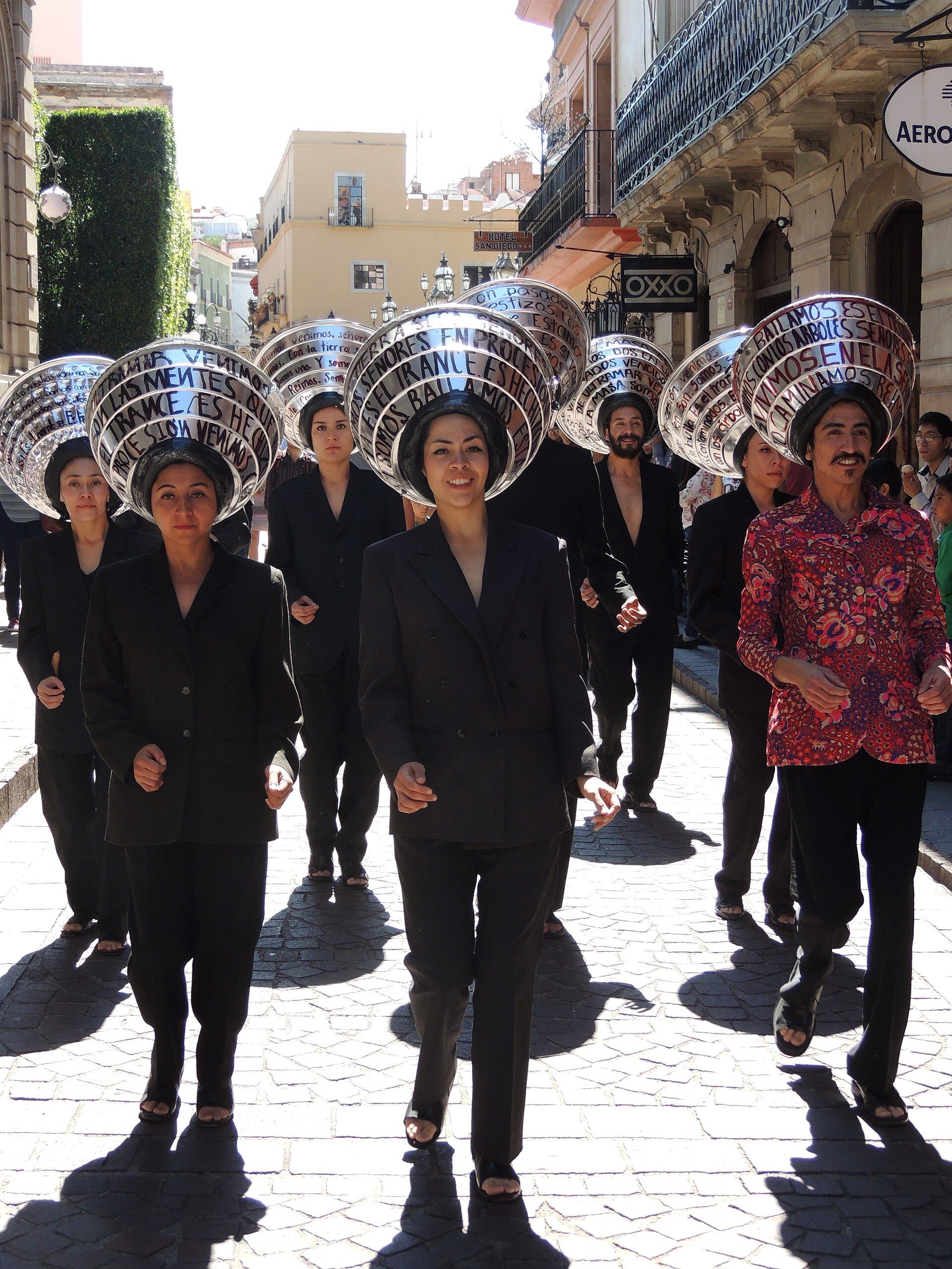 LosTheUltramar performers walking through Guanajuato during Cervantino