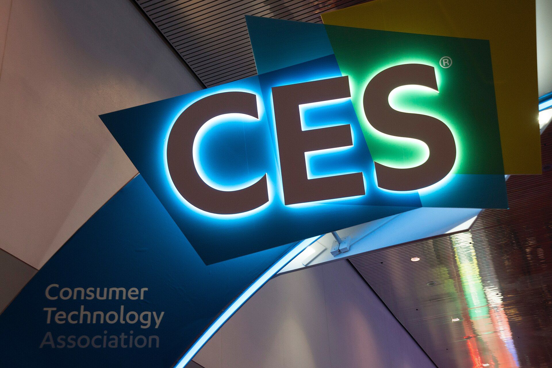 A large CES sign above attendees on the Las Vegas show floor