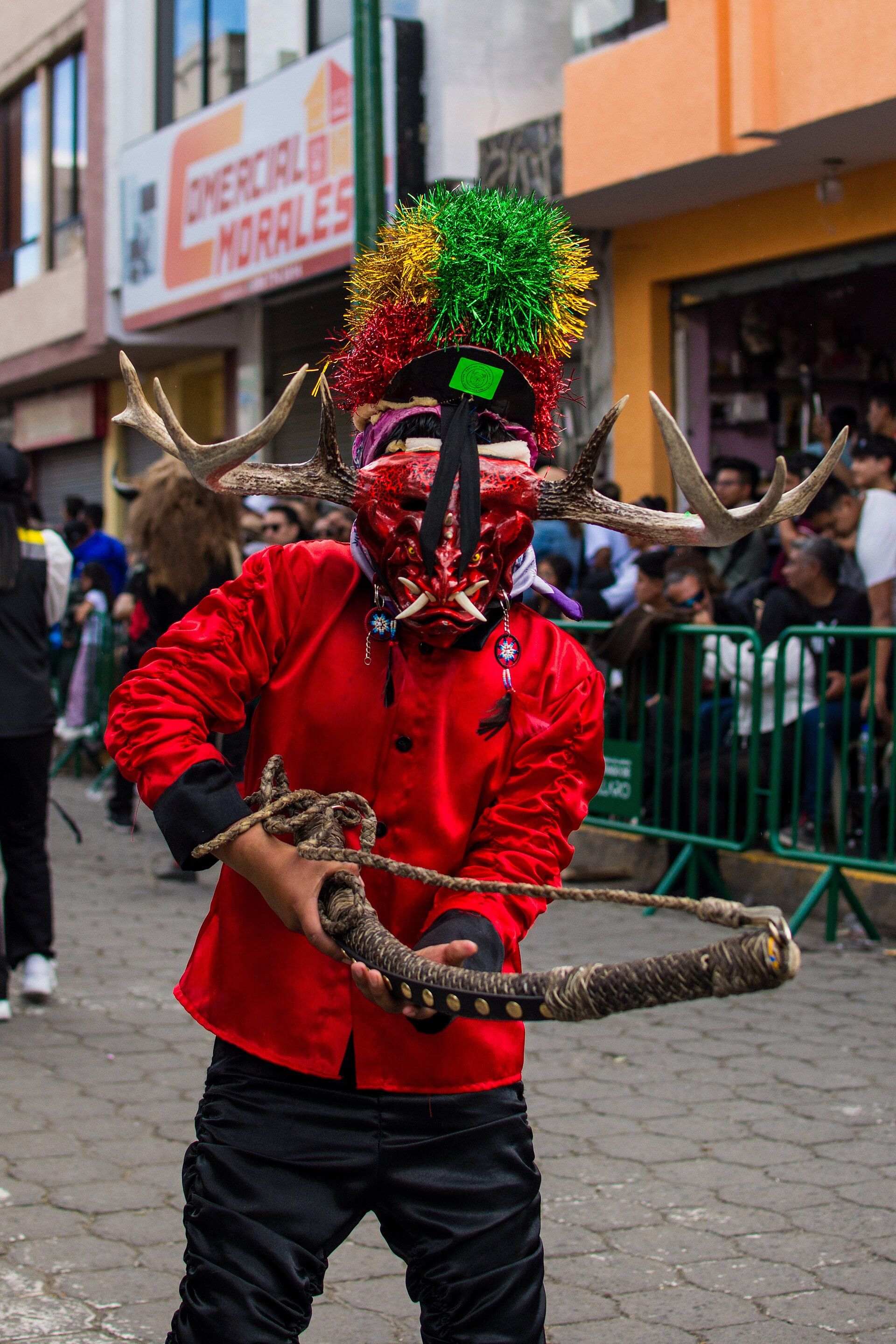 A Diablada Pillareña dancer preparing an acial movement