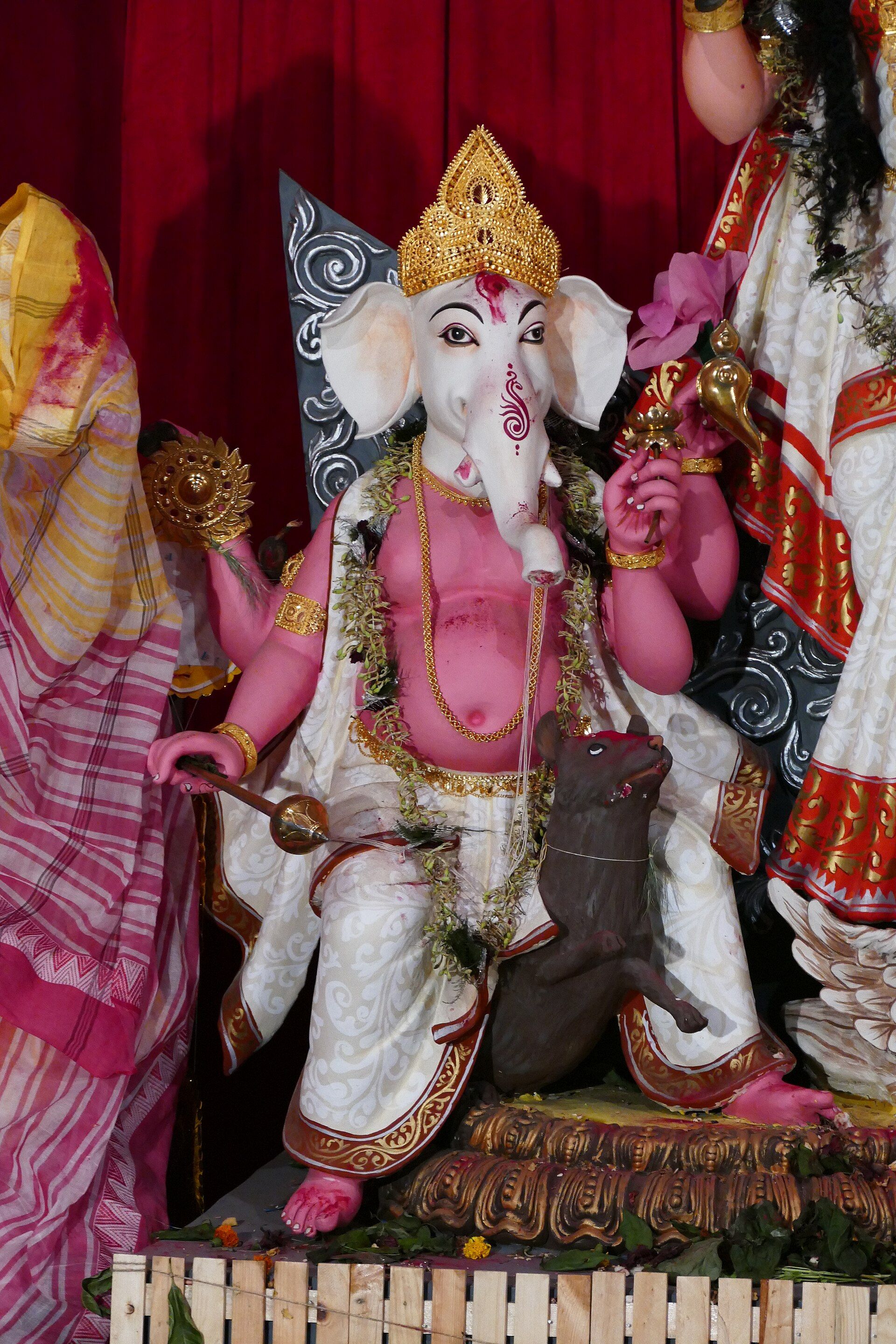 Visitors inside an elaborately decorated Durga Puja pandal in Kolkata