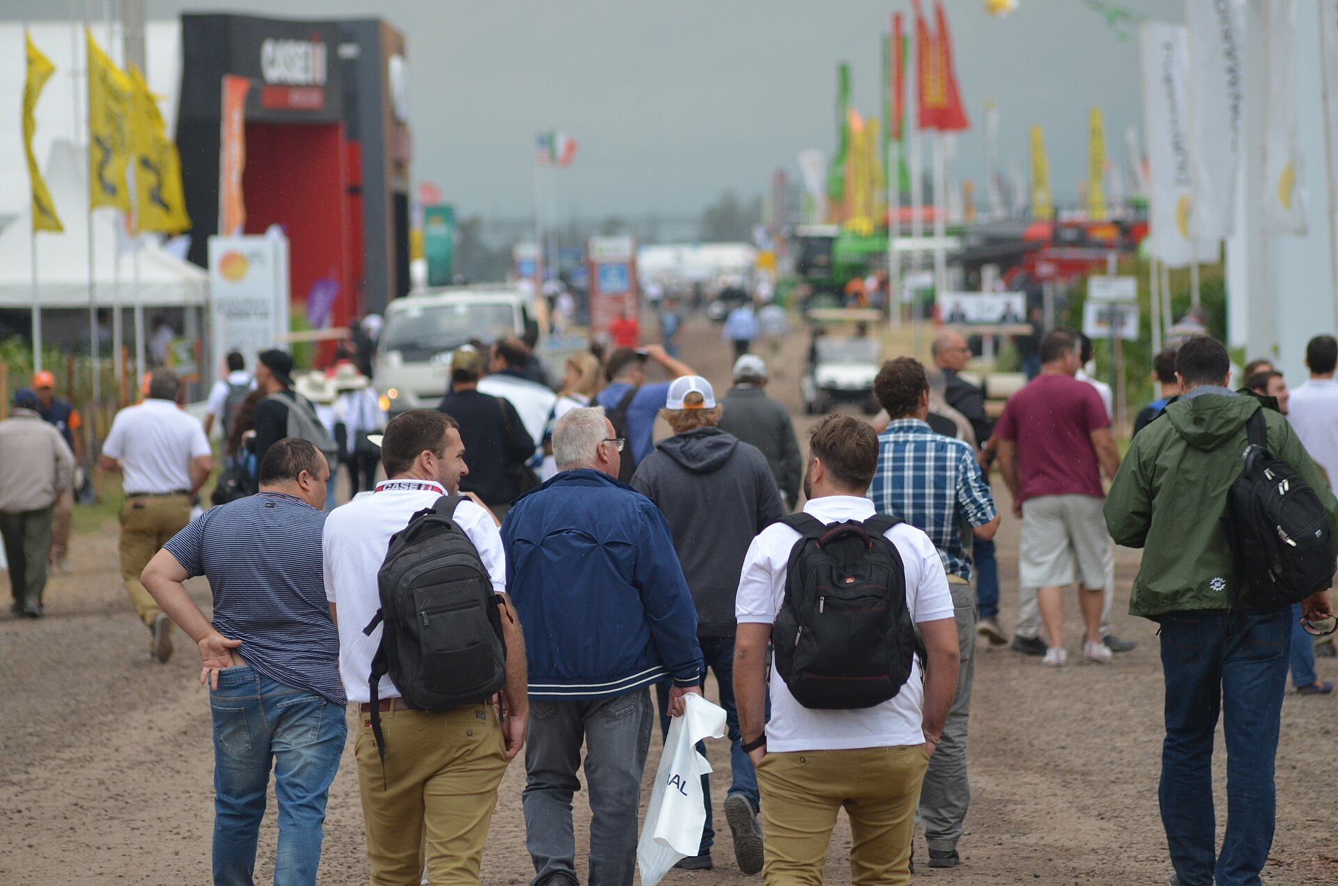 Visitors walking an outdoor avenue at Expoagro 2020