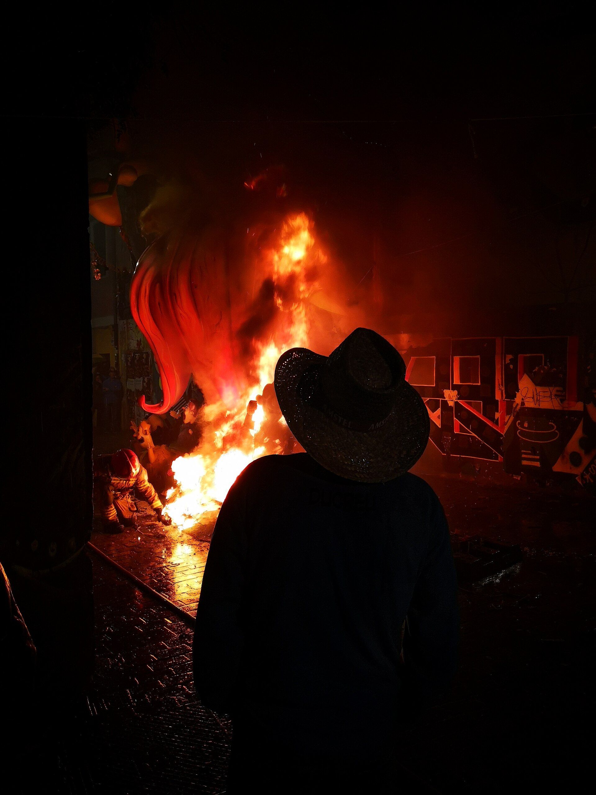 A neighborhood falla burning during the Cremà