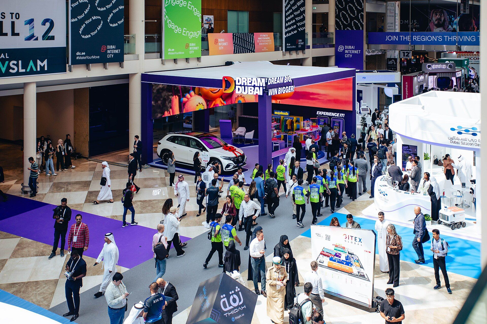 The busy exhibition floor around a mobility display at GITEX Global 2023