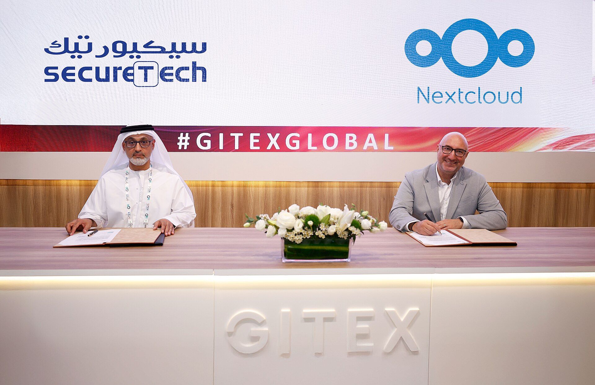 A technology partnership signing at GITEX Global
