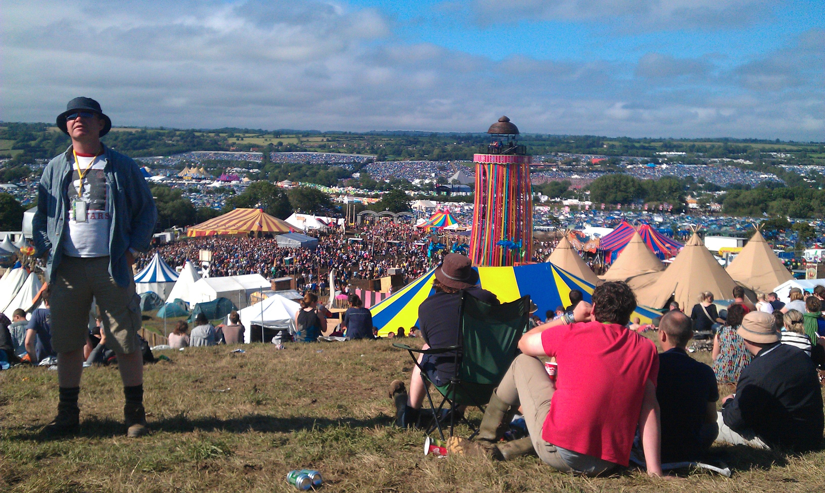 The Glastonbury festival site seen from the Park Stage in 2011 as the crowd arrives for Pulp, shown as historical context.