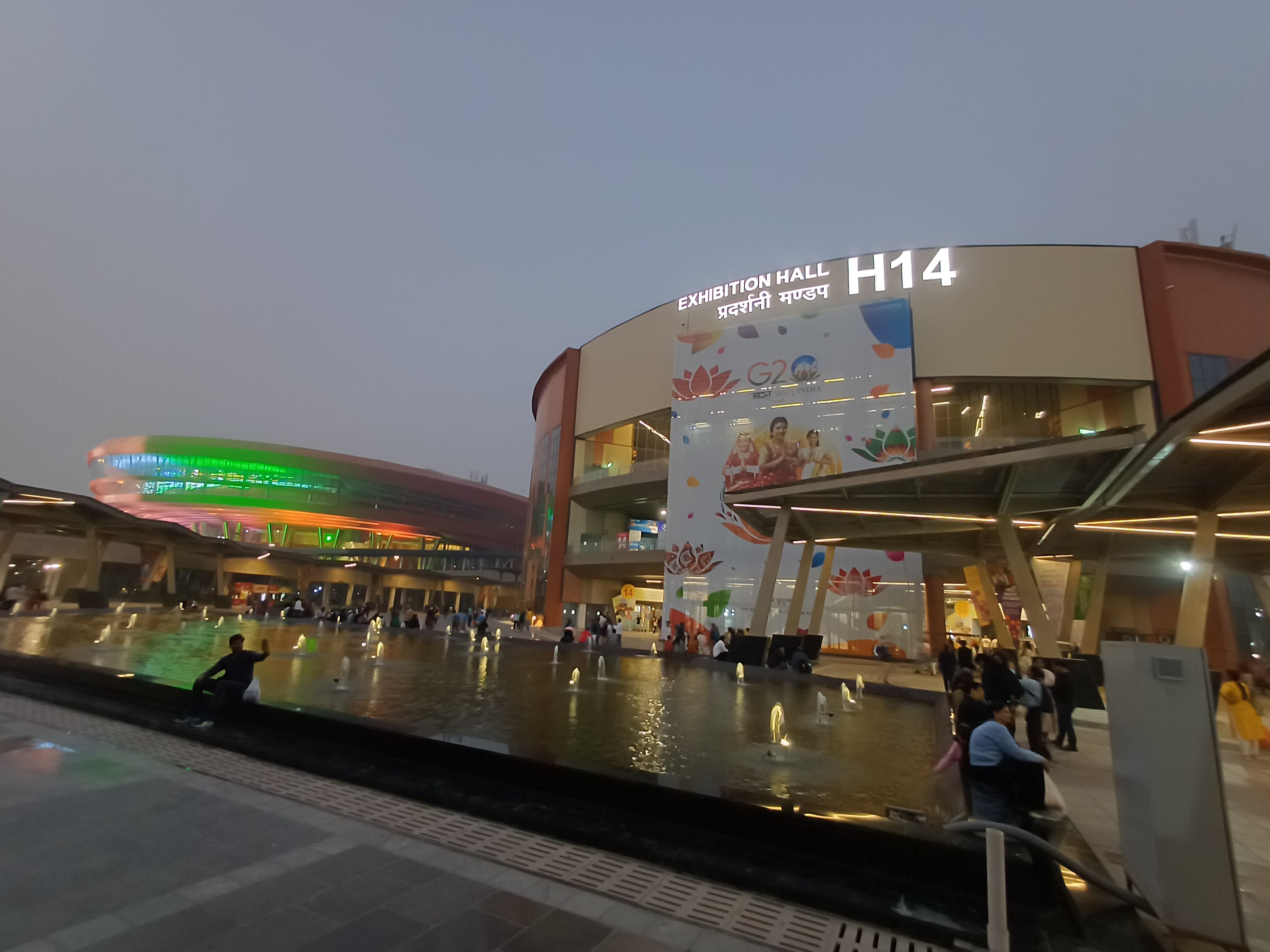 Pragati Maidan Hall 14 and Bharat Mandapam illuminated at night, photographed in 2023 (venue context, not the 2026 fair)