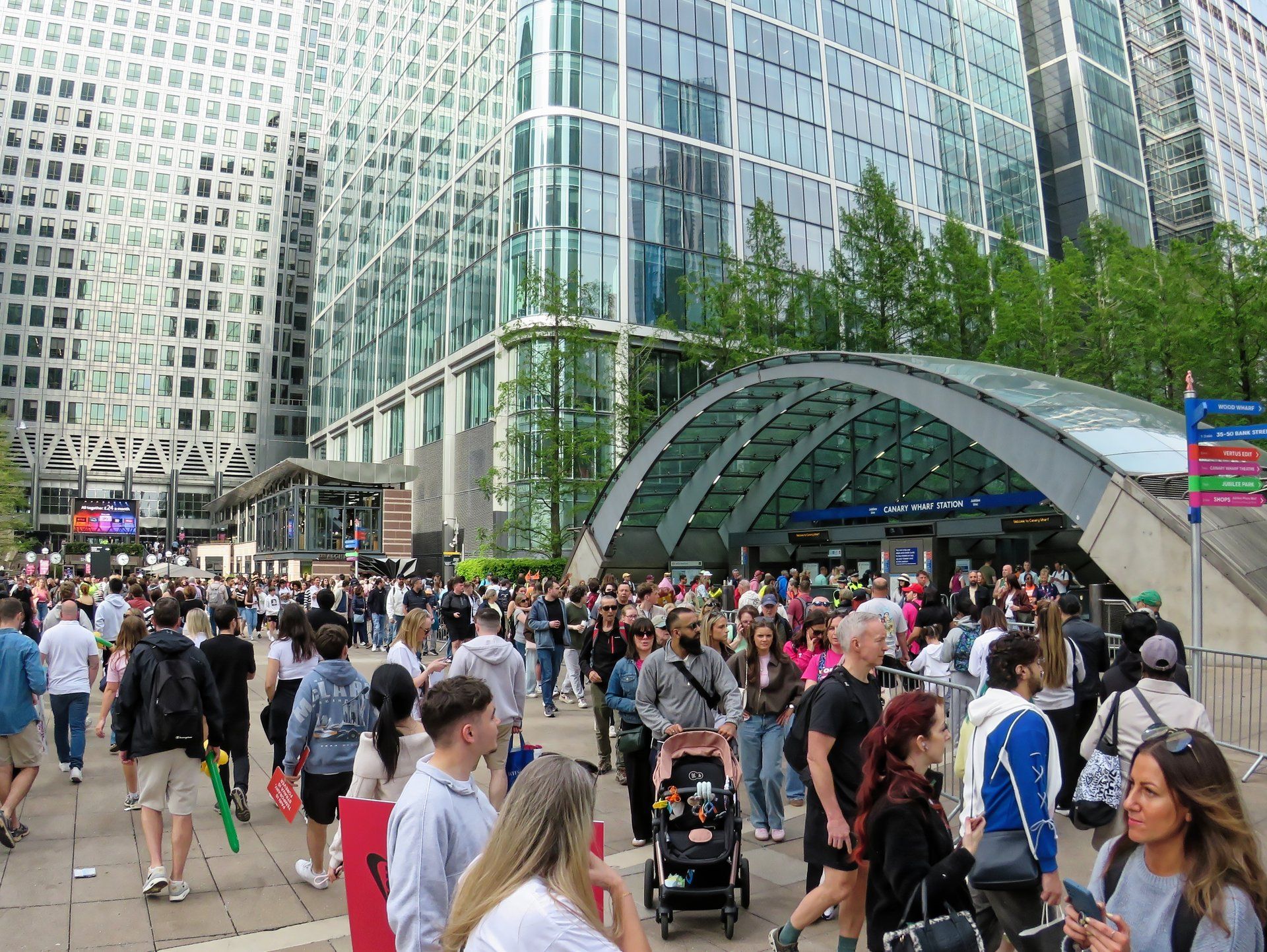 Spectators at Canary Wharf station during the 2026 London Marathon (event context, not the 2027 event)