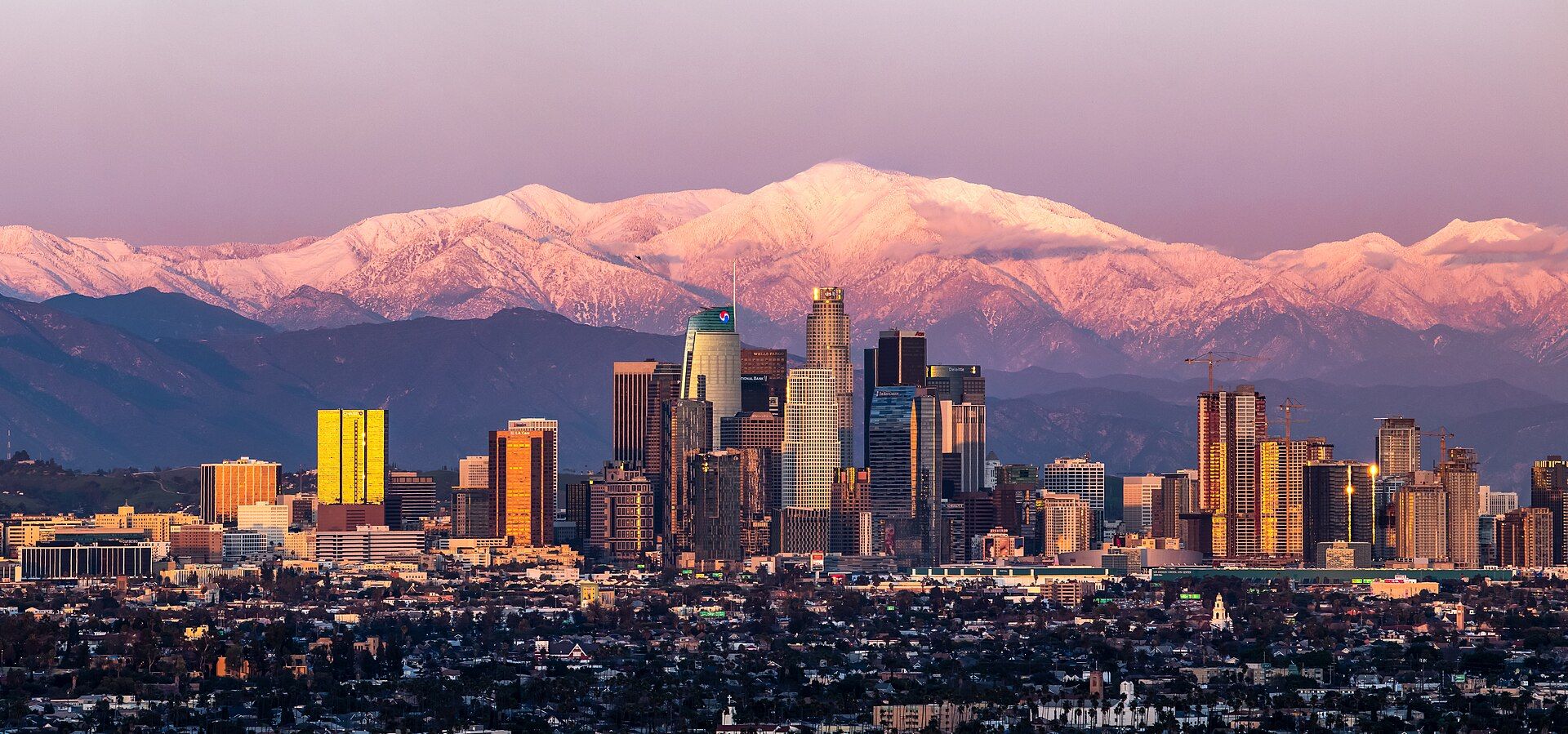 Downtown Los Angeles skyline at sunset in February 2019 with Mount Baldy behind. Host city context photo, not the 2027 Super Bowl.