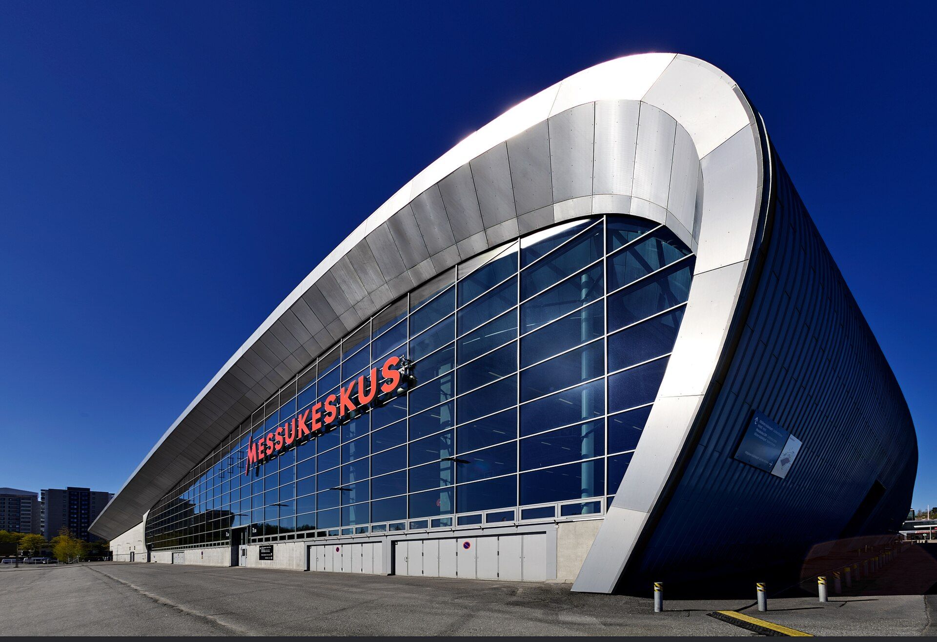The curved glass exterior of Messukeskus Hall 7