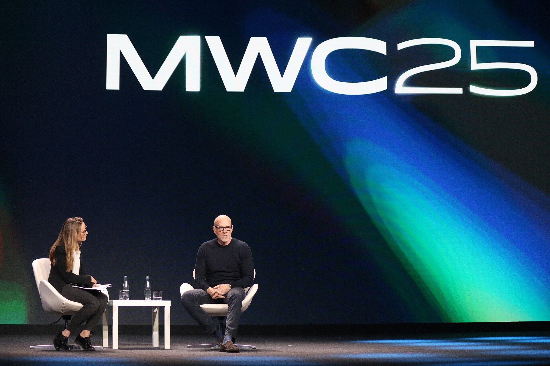 Scott Galloway in a stage conversation beneath MWC25 signage
