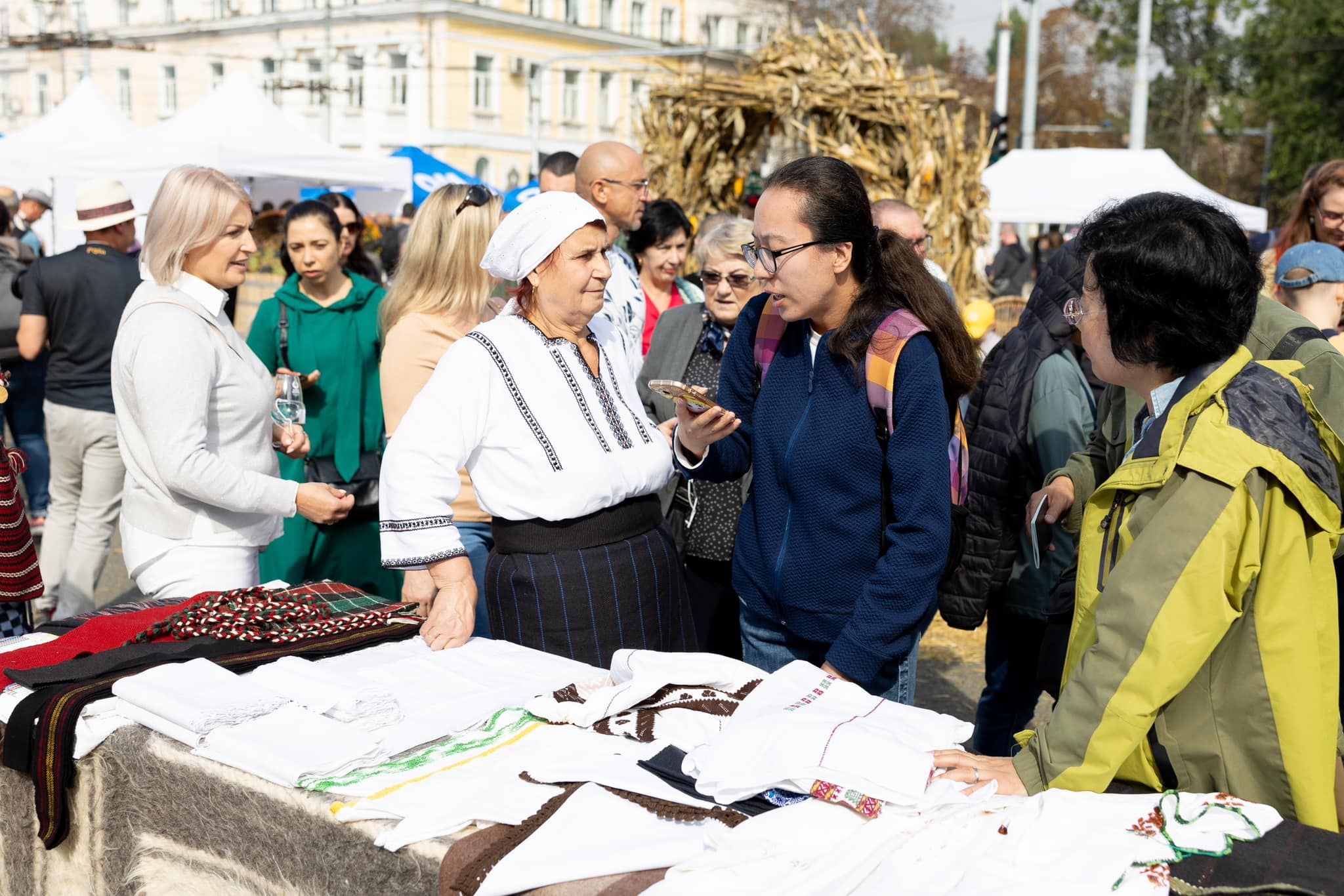 Visitors speaking with a textile maker at Moldova National Wine Day