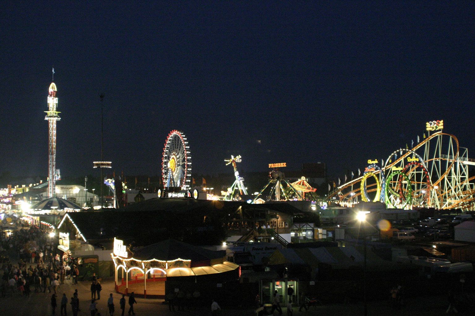 Oktoberfest festival grounds illuminated at night in Munich