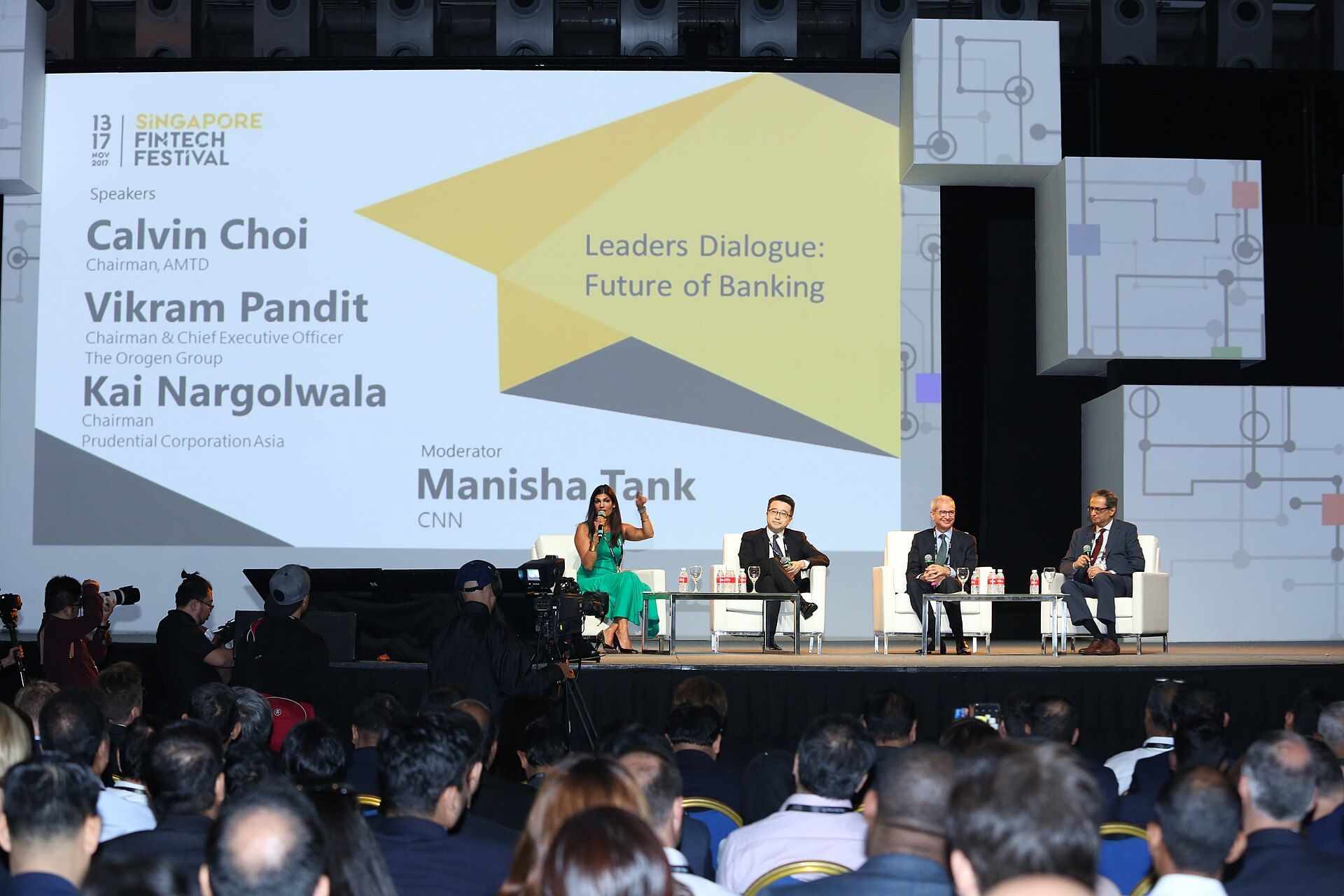 A leaders dialogue before a full audience at Singapore FinTech Festival