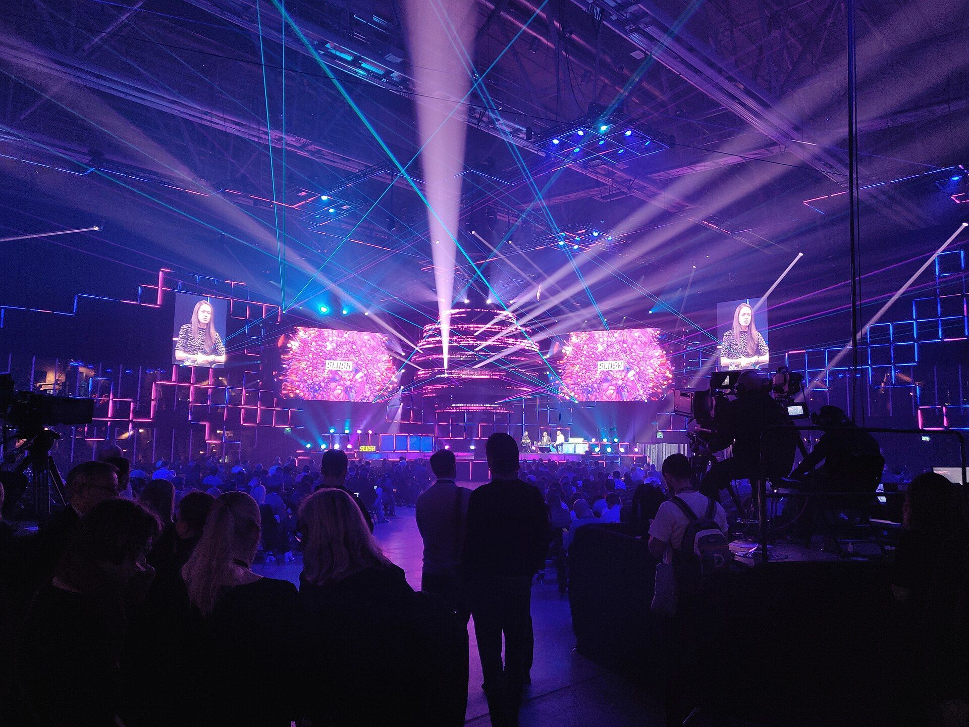 A packed Slush stage under the event’s distinctive laser lighting