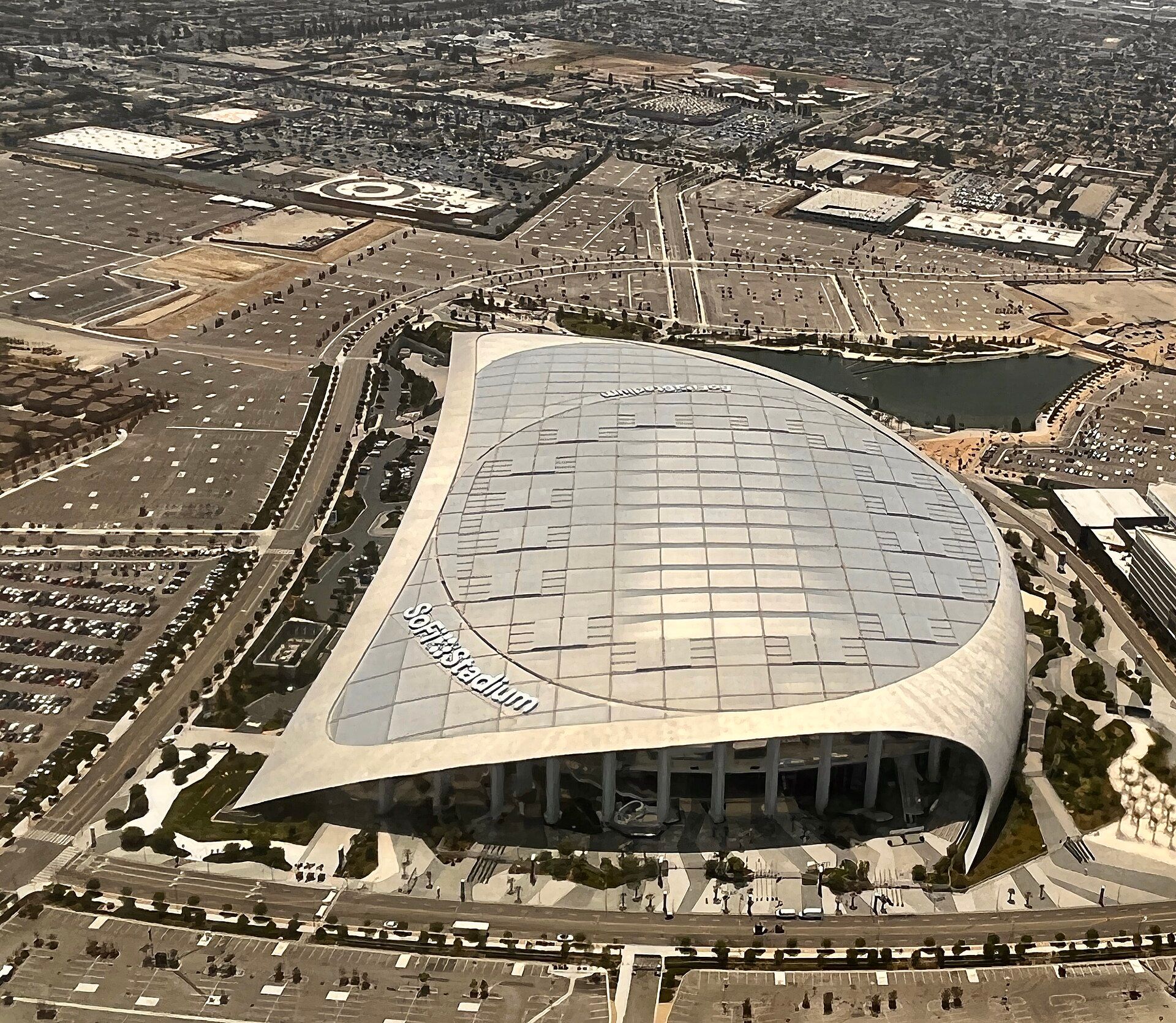 Aerial view of SoFi Stadium and the surrounding Hollywood Park site, photographed in July 2022. Venue context photo, not the 2027 Super Bowl.