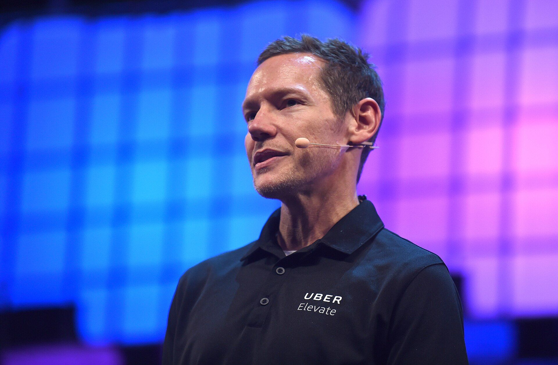 A technology executive speaking on Web Summit Centre Stage
